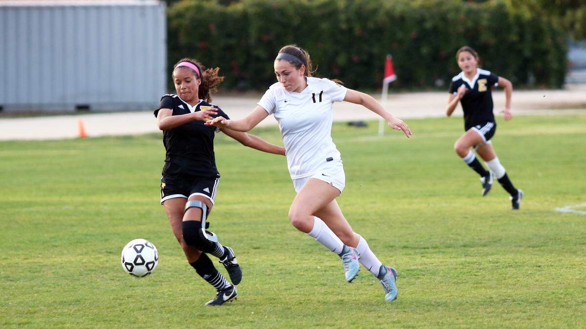 SLO High junior Olivia Ortiz battles with an Edison defender in the first round of the Division 2 CIF Southern California Regional Girls Soccer Championships.