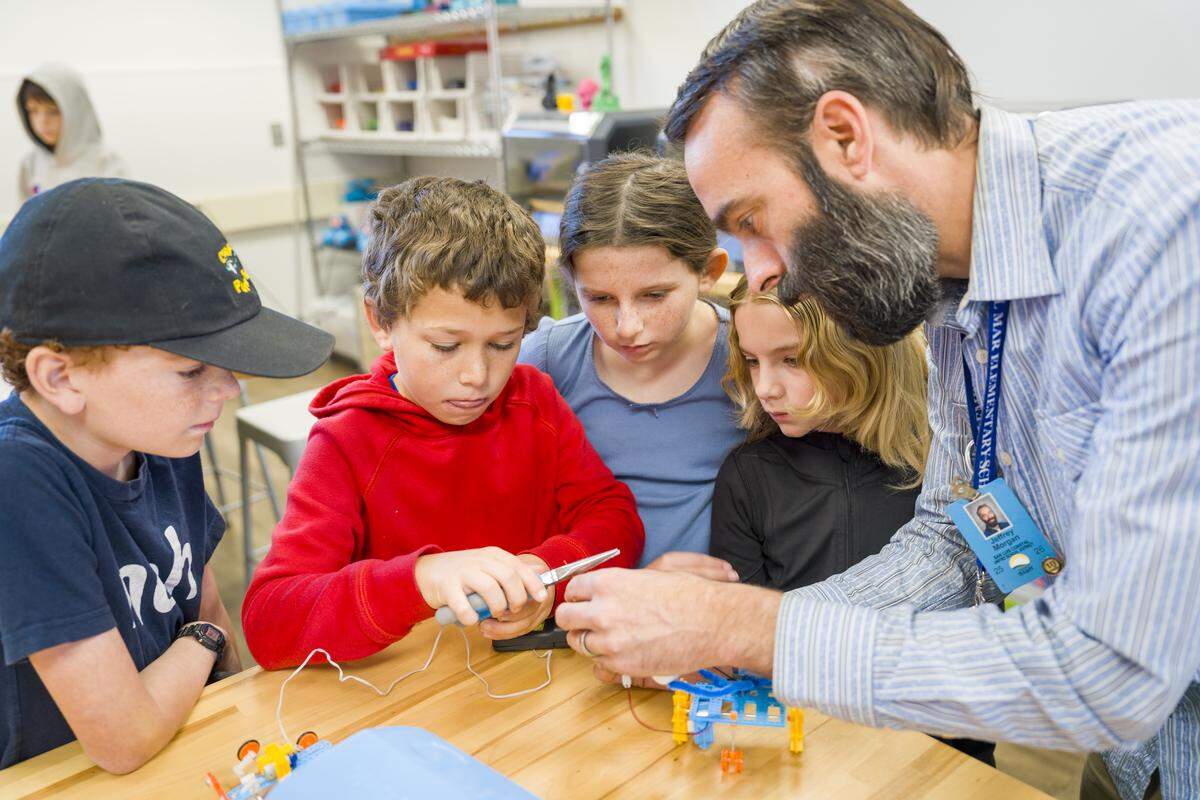 Students work with wiring and plastic building pieces at an innovation lab at Del Mar Elementary School. The San Luis Coastal Education Foundation runs the iINNOVATE program in local schools.