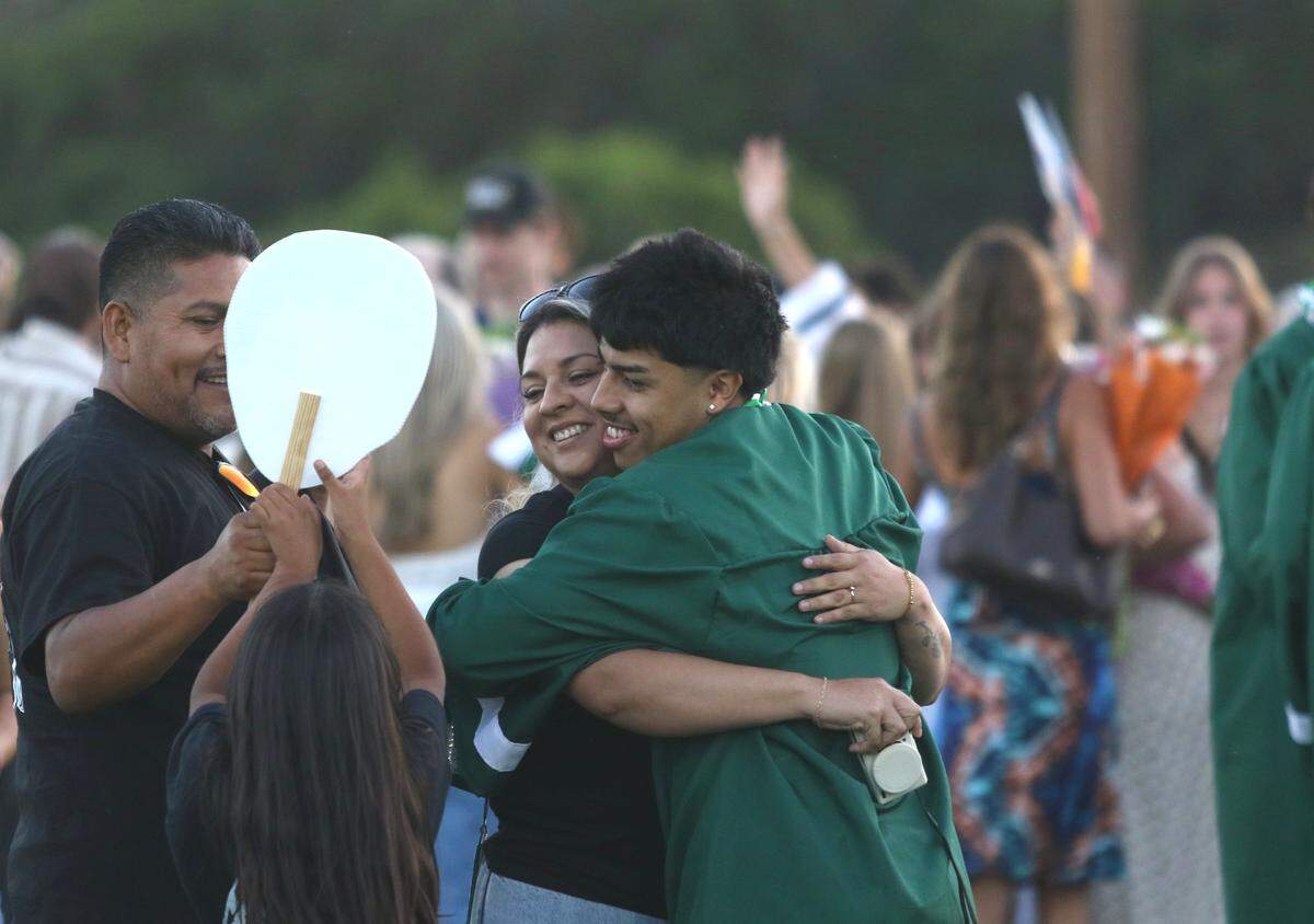 Templeton graduate Armando Soto hugs his mother, Maria Calderon, after the high school graduation ceremony on June 4, 2026. Soto was one of 186 graduates.