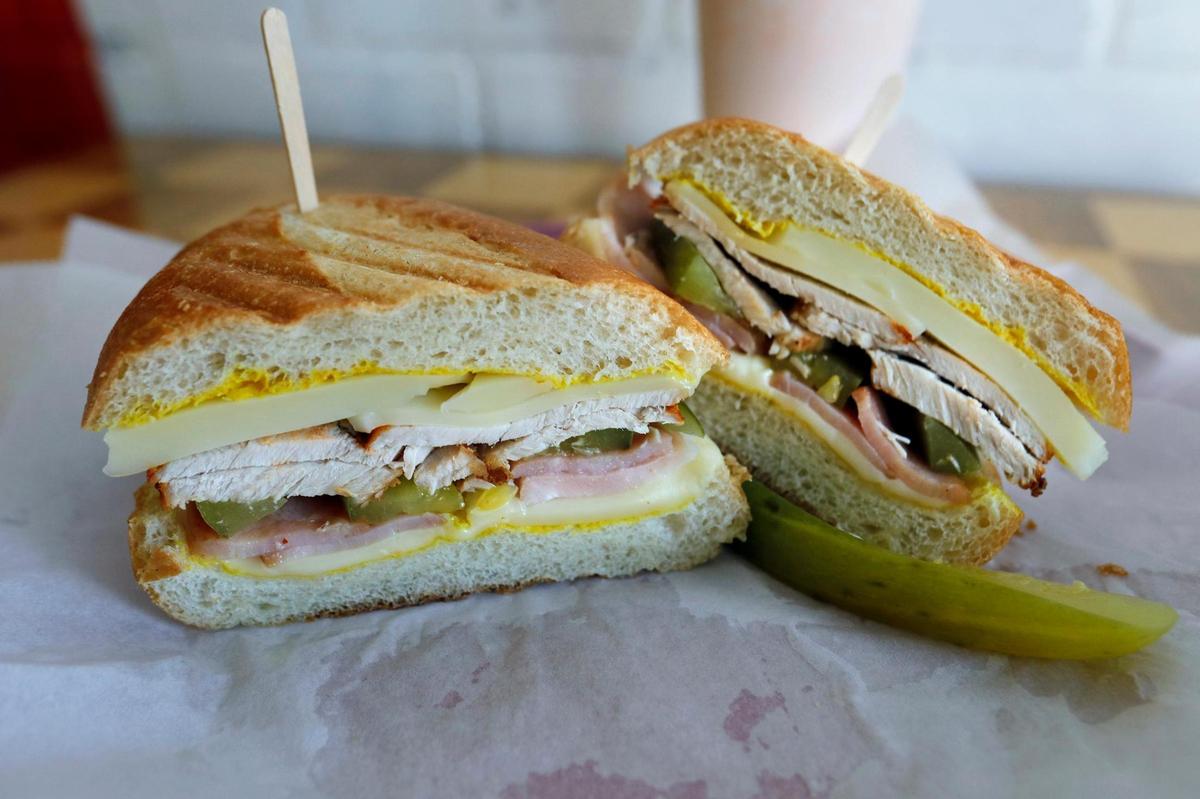 This torta-style Cuban sandwich served at Luna Llena Deli features sliced pork, smoked ham, Swiss cheese, pickles and mustard. Father-son team Gil Ruiz, Sr., and Gil Ruiz, Jr., opened the restaurant at 859 Main St. in October 2022.
