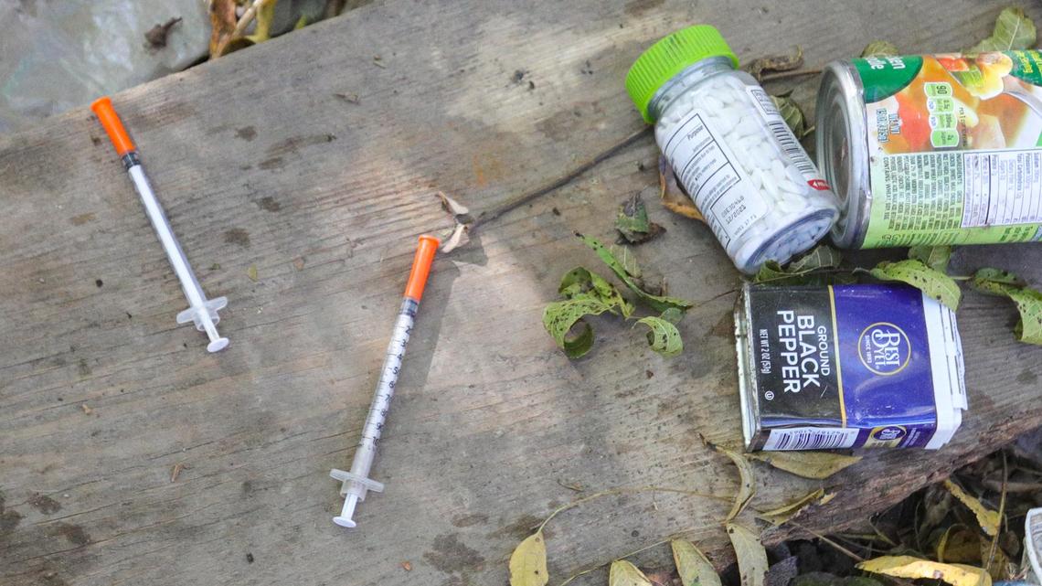 Syringes for drug use are often found near camps like these in the San Luis Creekbed. Needles from illicit drug use washing downstream is a concern. Homeless camp cleanup prep Bob Jones Trail.