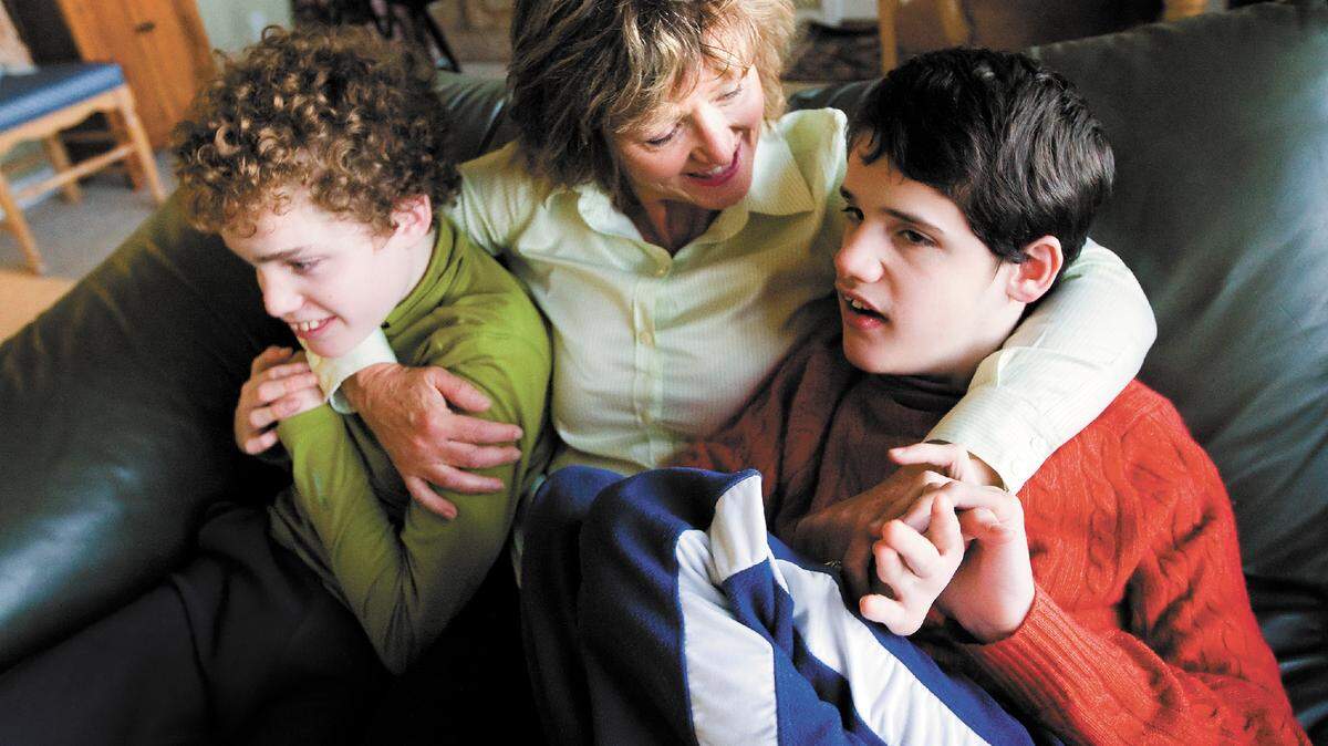 Melanie Cleveland with her two sons George, 17, left, and Alex, 18.