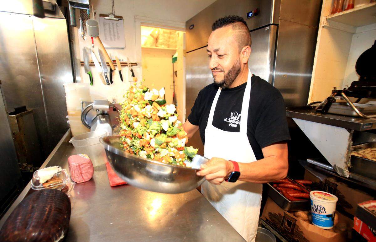 Formerly named The Best Ever Grill, Louisa’s Place was renamed in 1976. The casual breakfast-and-lunch diner has been located at 964 Higuera St. in downtown San Luis Obispo since it opened in 1958. Salad-tossing Jorge Ponce has been the baker and a prep cook there for 14 years.