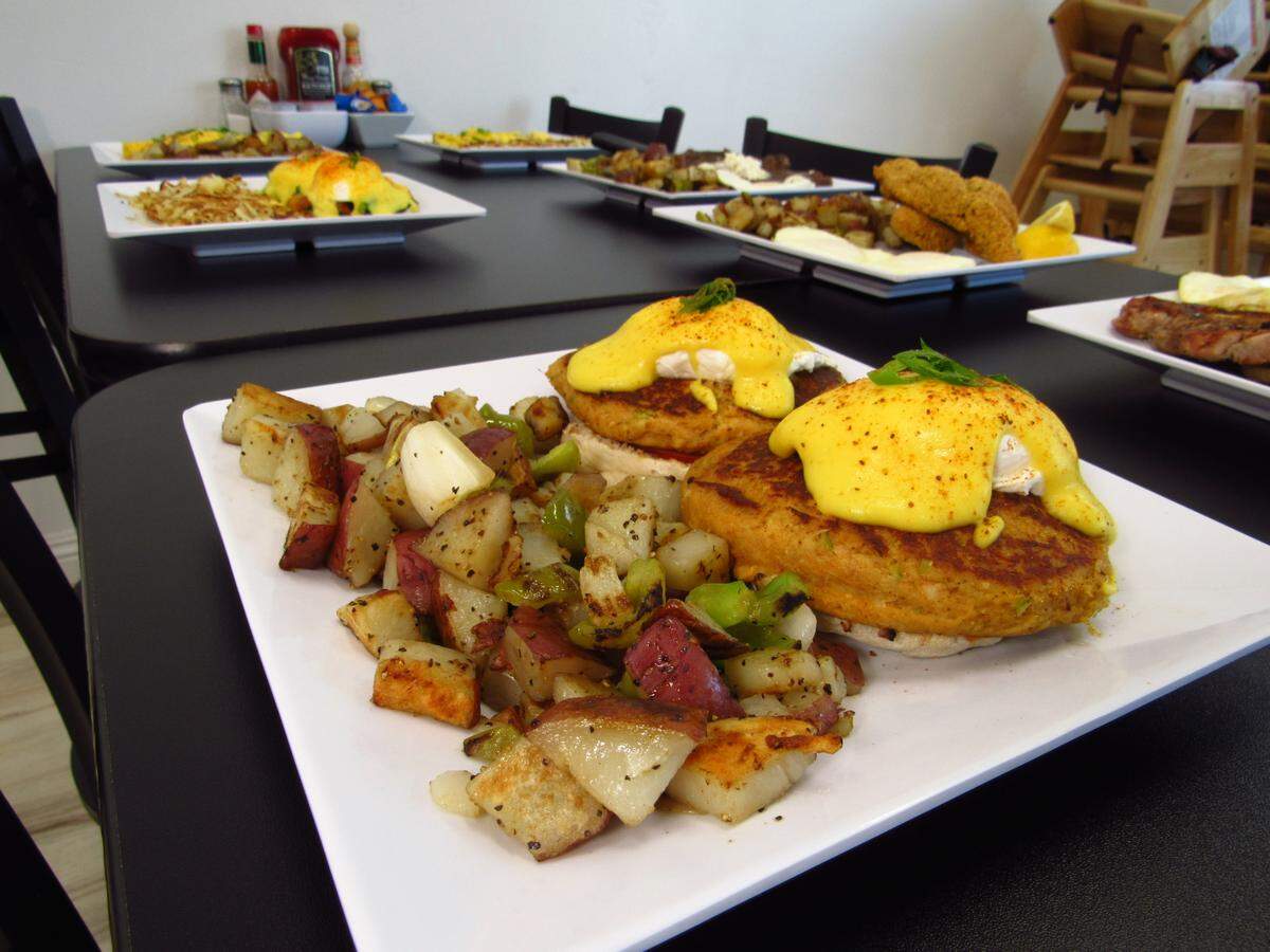The menu for Honey I’m Home Pismo Cafe includes eggs Benedict, like the crab cake Benedict with country potatoes, seen here on Friday, July 18, 2025.