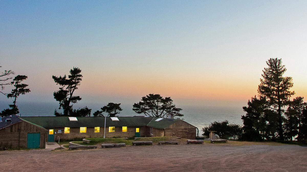 The setting sun highlights the dramatic setting of and view from Cambria’s Camp Ocean Pines.