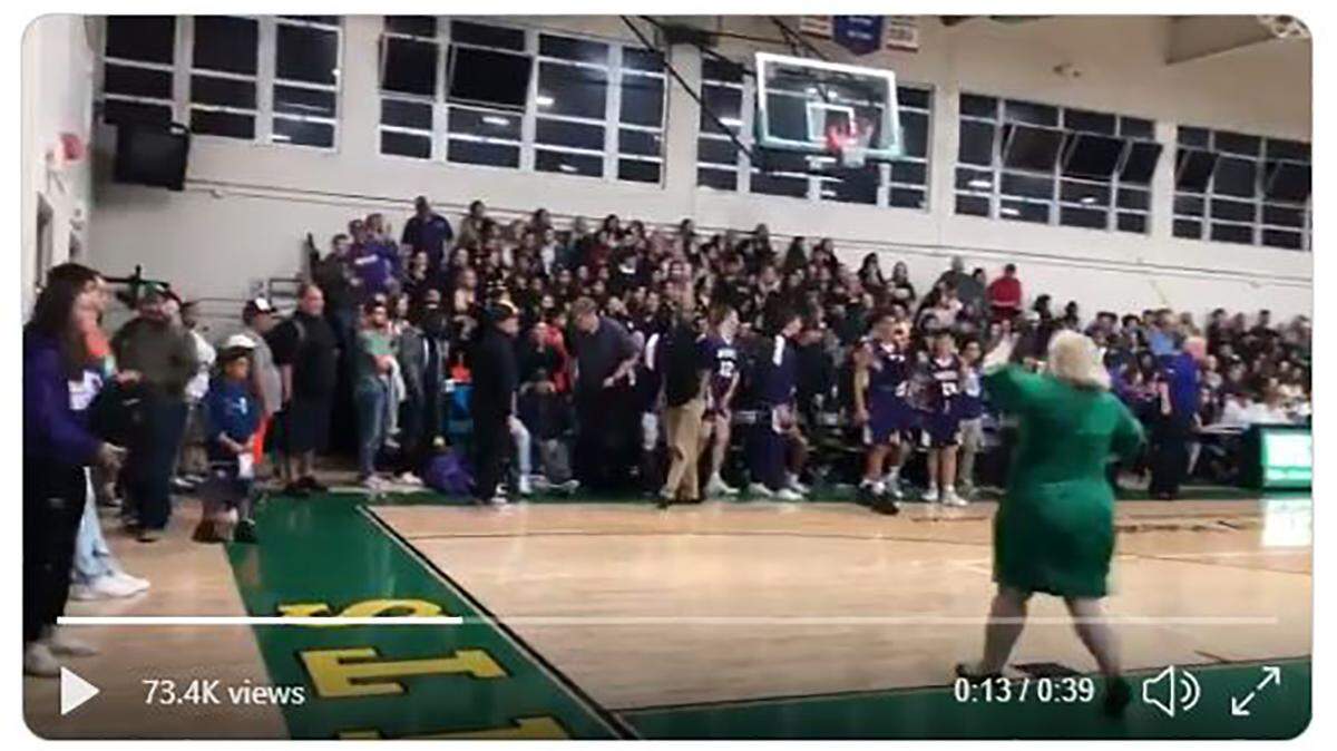 St. Joseph’s Principal Erinn Dougherty confronts Righetti High School fans chanting “Where’s your passport?” at St. Joseph’s players during Tuesday night’s game.