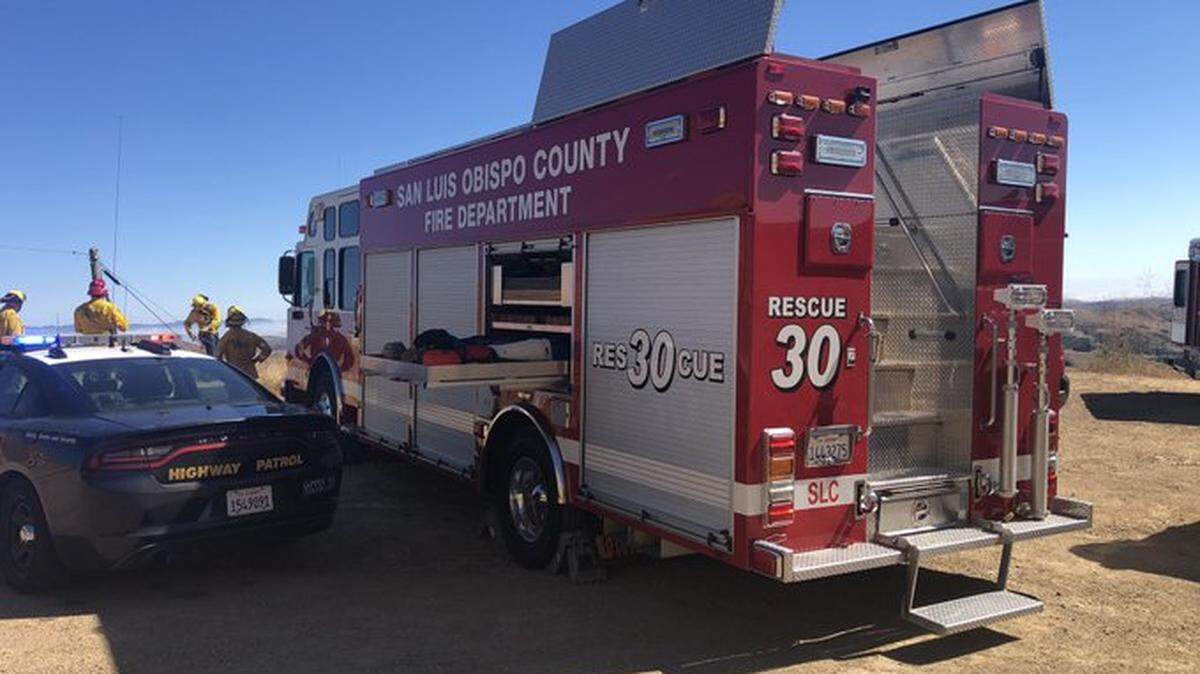 Cal Fire firefighters helped remove two people from the wreck of a Tesla that crashed about 200 feet down a hill on Highway 46 Thursday, July 4, 2024.
