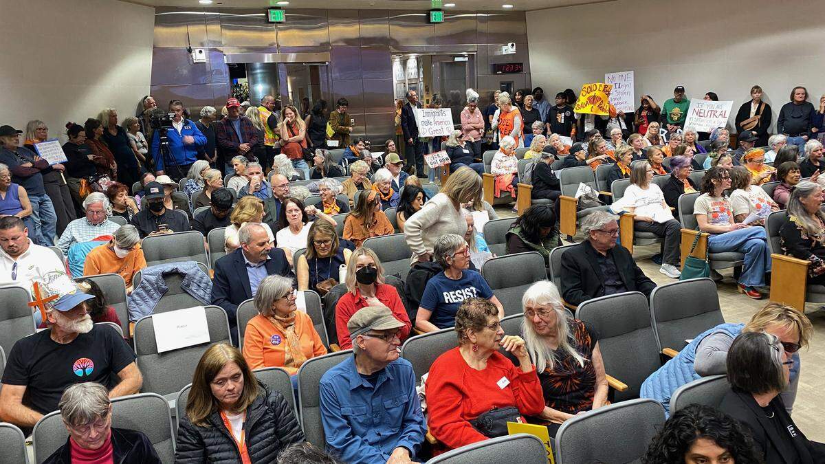 Protesters packed the San Luis Obispo County Board of Supervisors meeting on Jan. 27, 2026, ahead of a forum with the Sheriff’s Office on local ICE activity data.