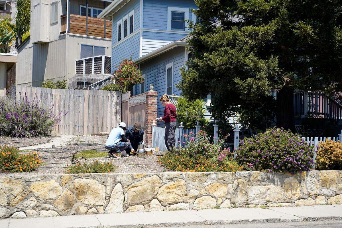 Environmental engineer Tim Nelligan, center, performs soil vapor testing in the front yard of the property next door to Susan Flores’ home on East Branch Street in Arroyo Grande as part of the Kristin Smart investigation on May 6, 2026. Susan Flores is the mother of Paul Flores, who was convicted of Smart’s murder in 2022.