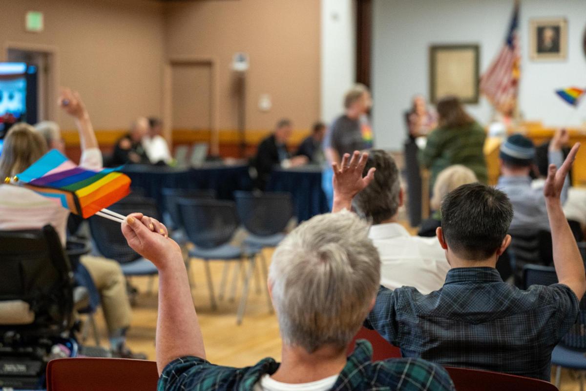 Onlookers wave Pride flags during the Morro Bay City Council meeting on Tuesday, May 14, 2022. Pride flags and other commemorative flags will not be flown over Morro Bay city buildings following 2025’s Pride month after the City Council voted to repeal a 2022 ordinance that allowed for commemorative flags to be flown.