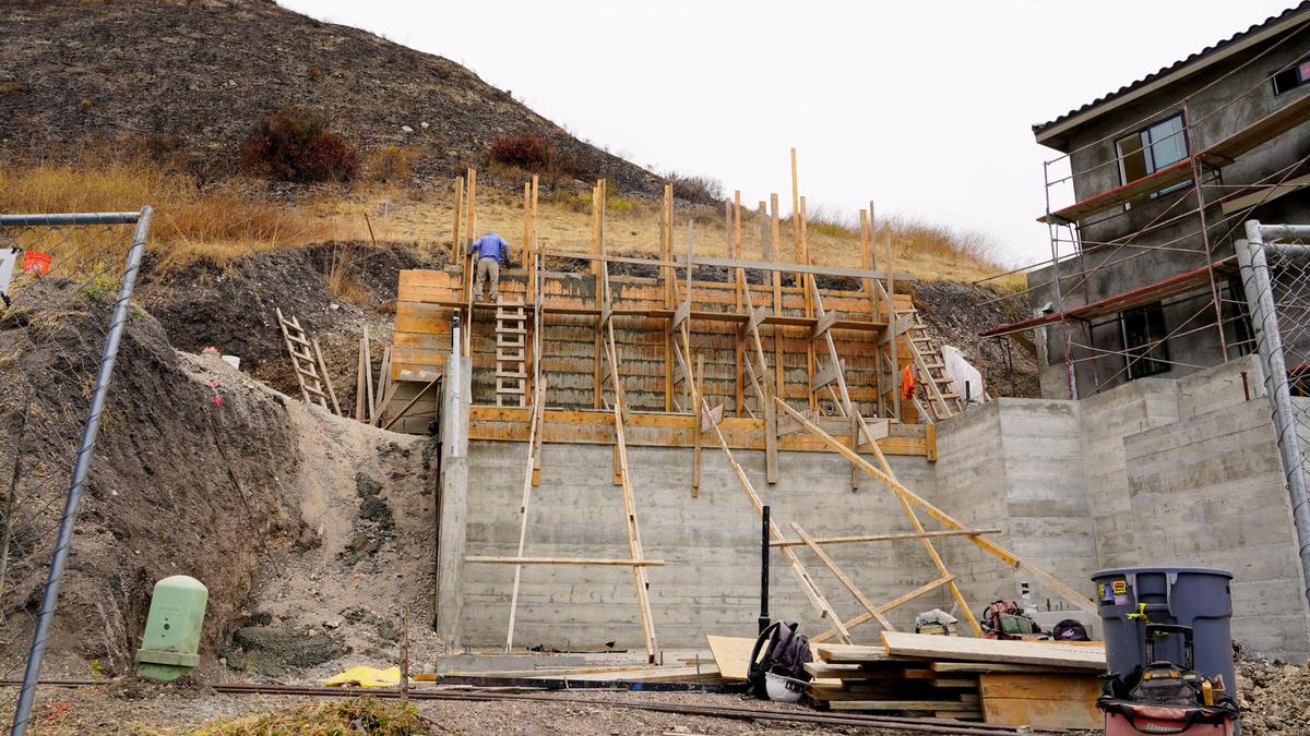 The unfinished garage of one of the three-story homes in the Barcelona Point luxury home development is pictured here Tuesday, July 1, 2025. The development is nestled into the base of the mountains that border Pismo Beach to the east, requiring some home lots to be leveled and reinforced prior to building.