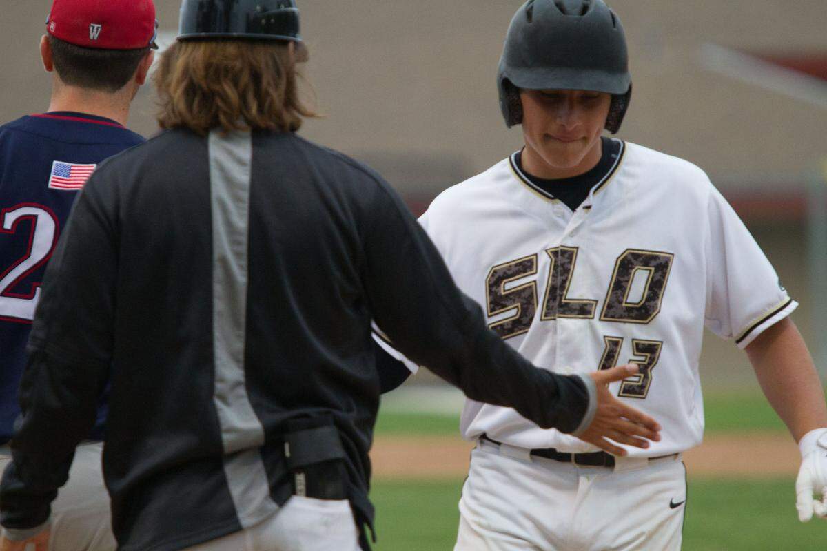 Emilio Corona celebrates a two-run single in San Luis Obispo’s 8-4 win over Western Tulare in the CIF-Central Section Division I playoffs on Wednesday. The junior is headed to Washington to play baseball.