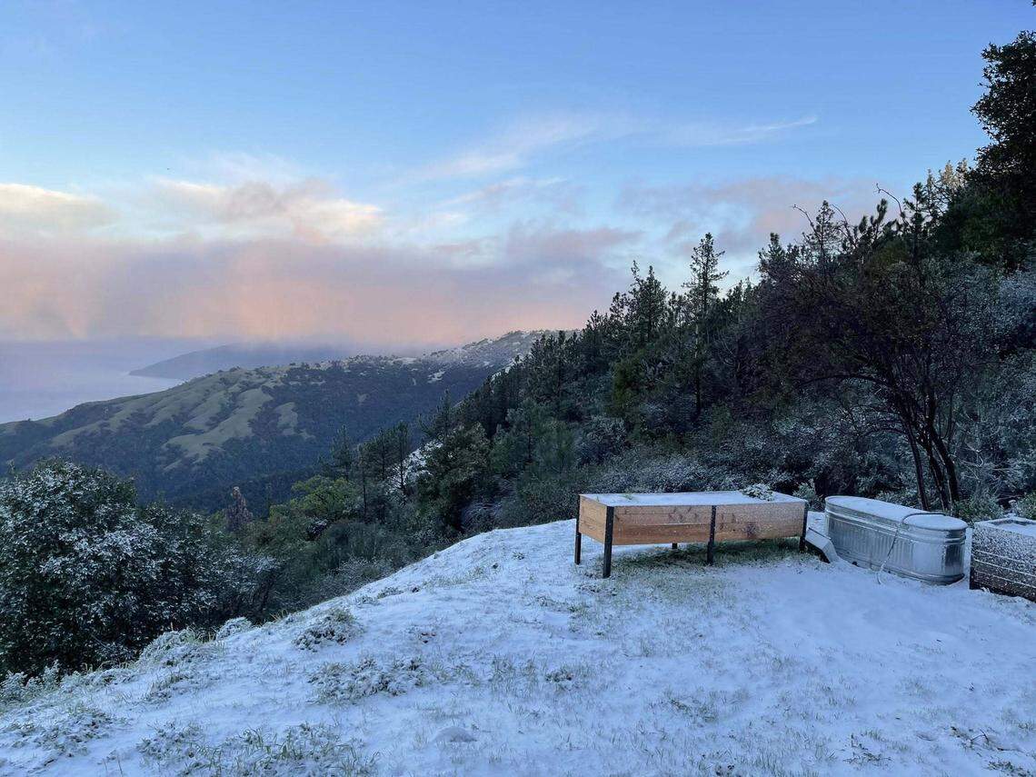 Snow dusts the hills along the Big Sur coast on Wednesday, Feb. 18, 2026.