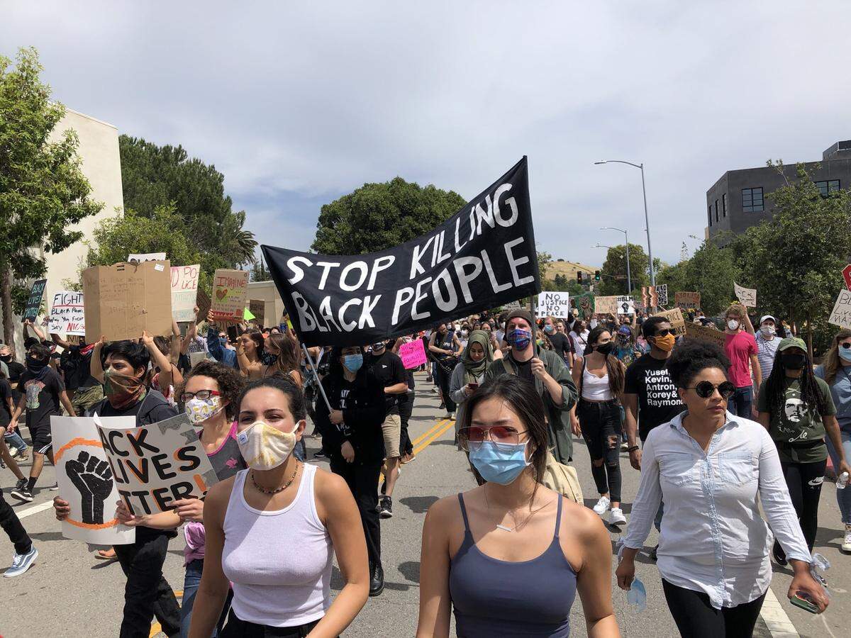 Protesters march in downtown San Luis Obispo on Sunday, May 31, 2020.