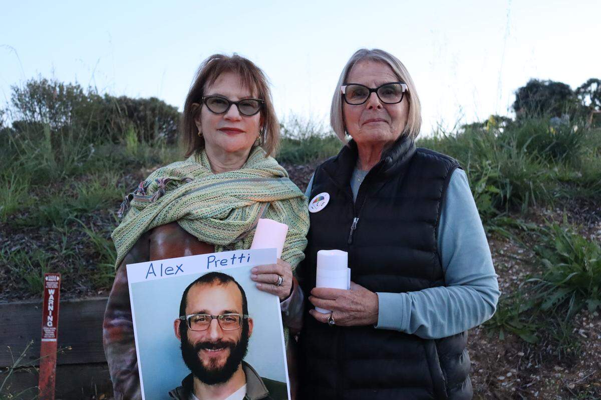 Dorothy Slegman, left, and Karen Oothoudt, best friends and snowbirds who have visited Morro Bay from Minnesota together every winter for nearly a decade, attended the Los Osos vigil for Alex Pretti on Jan. 26, 2026. Pretti is the second person killed by federal immigration officers in Minneapolis in a month.