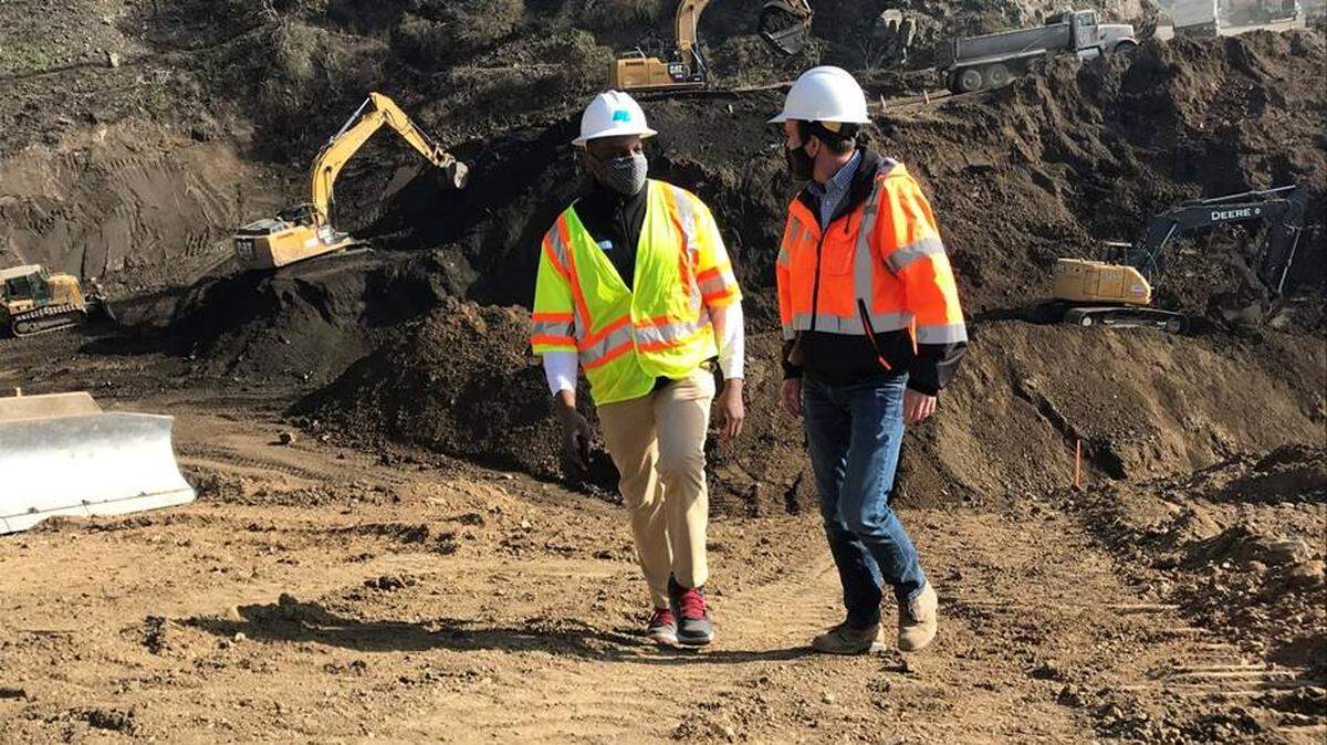 Caltrans state director Toks Omishakin and District 5 construction chief Tim Campbell at on the north side of the canyon at the Rat Creek repair site at Highway 1 near Big Sur.