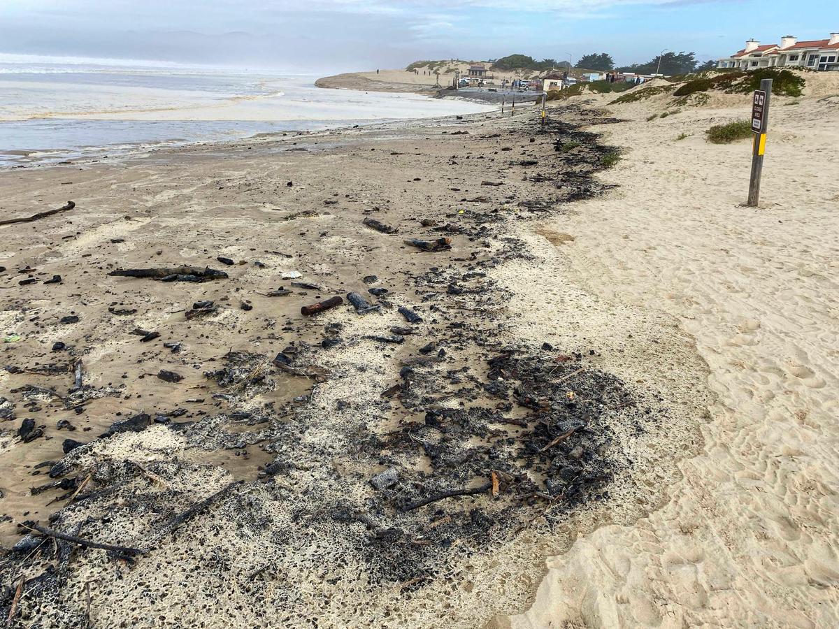 Storm driven high swells on the ocean combined with seasonal high tides washed debris on beach at Oceano Dunes SVRA, including firepit ashes and driftwood Dec. 28, 2023.