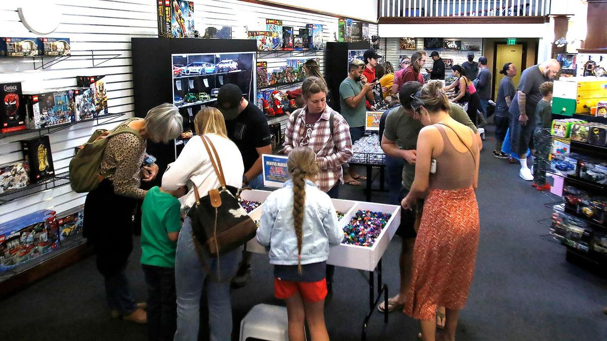 New customers pack the Bricks & Minifigs store on Nov. 19, 2022. The new Lego store in San Luis Obispo sells and trades used Lego bricks and minifigures.