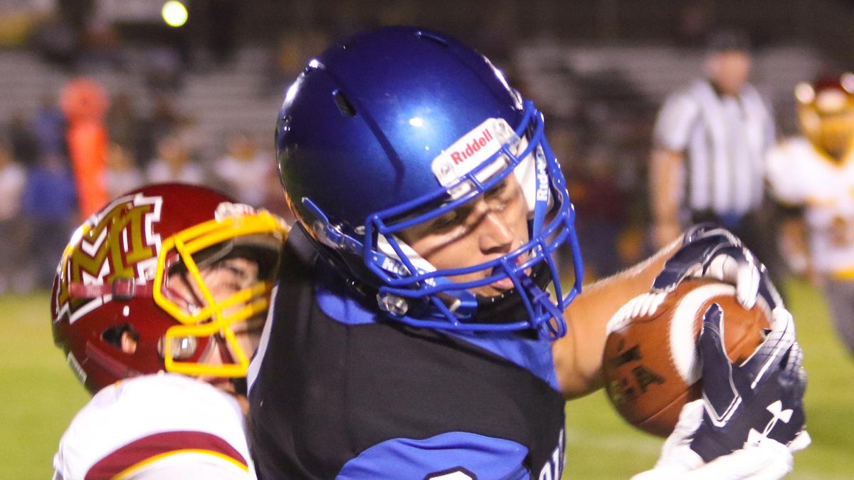 Morro Bay High School reciever Eli Graves catches a pass in the Pirates’ game Friday night against Mira Monte of Bakersfield.