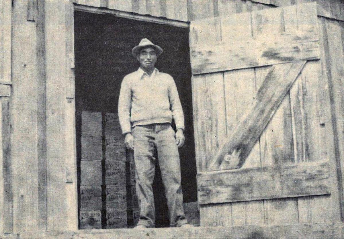 Tameji Eto stands in the doorway of a warehouse at his Los Osos farm in 1939.
