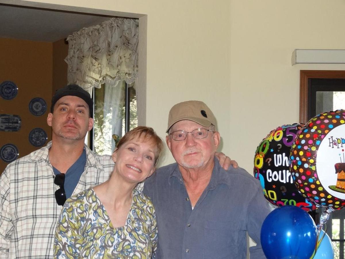 Atascadero resident Brian Hesse, right, gets a surprise visit from his son, James, and daughter, Marcia, on Feb. 9, 2013, for his 70th birthday.