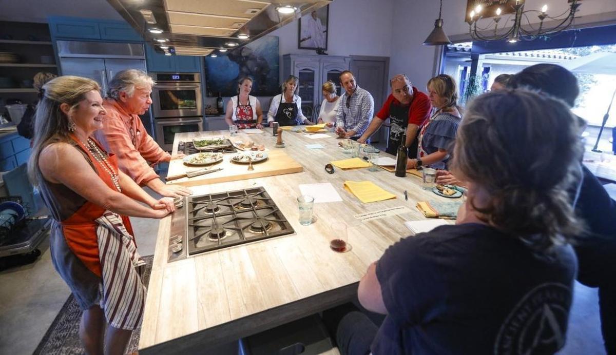 Cookbook author Brigit Binns and her husband, Casey Biggs, talk to students at an “Art of Artisan Pizza” cooking class at Refugio Kitchen in Paso Robles.