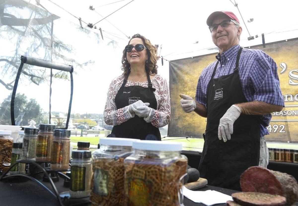 Bren’s Original Blends founder Bren Randolph, right, and his wife, Julie, offer samples of the Atascadero company’s seasoning blends at a recent Atascadero farmers market.