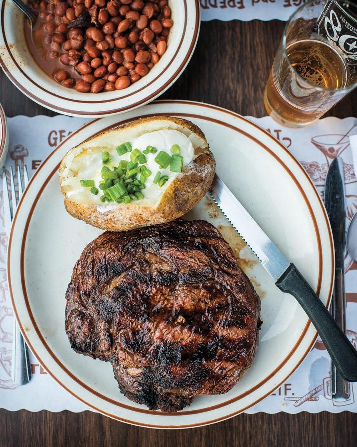 Santa Maria-style Spencer steak is served with a baked potato and pinquito beans at Jocko’s Steak House in Nipomo.