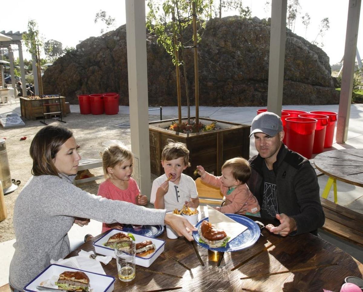 Katie and Matt Walsh enjoy a meal and beverages with their children — Julia, 2; Lucas, 4, and Audrey, 10 months — at SLO Brew’s The Rock in San Luis Obispo.