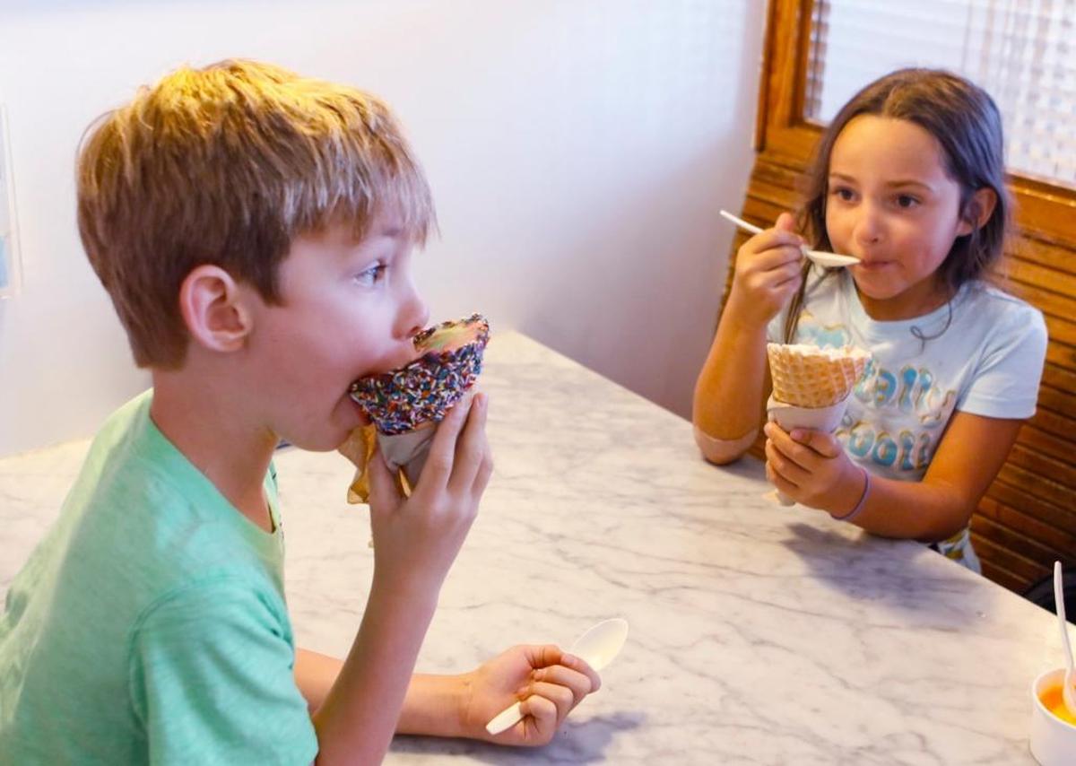 Jackson Baker, 6, tackles a cone of Straight to the Dentist ice cream, while Gwen Cooper, 8, has a combination of Caramel X-plosion and Birthday Cake ice cream at Doc Burnstein’s Ice Cream Lab in Arroyo Grande in 2016.