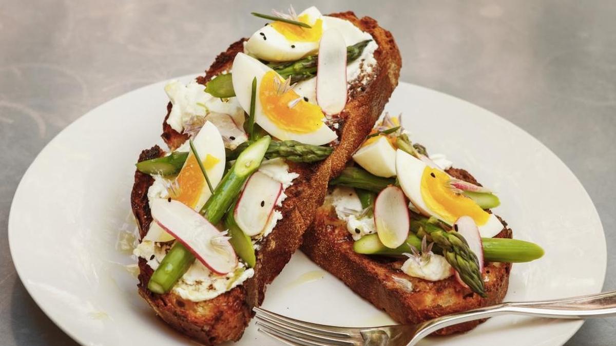 Thomas Hill Organics chef Tim Veatchâ’s asparagus tartine with chevre, radish, soft boiled egg and chive blossoms.