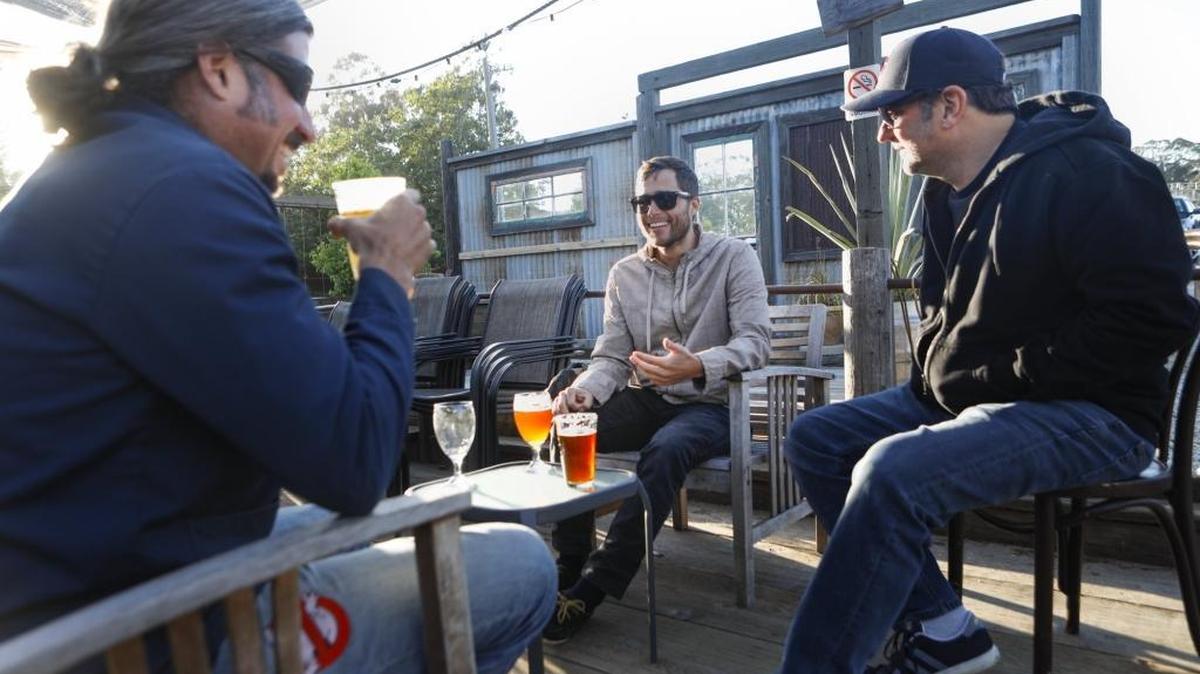 Jason Hilford, Jon King and Ben Erchul enjoy beers at Bang the Drum Brewery in San Luis Obispo.