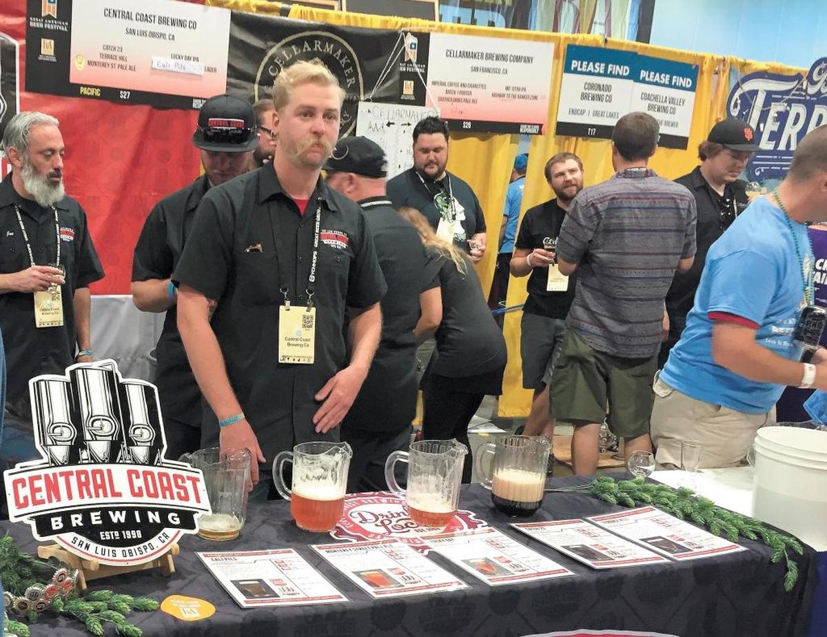 Skyler Oatman mans the Central Coast Brewing Co. booth at the Great American Beer Festival in Denver in 2015, the same year that the San Luis Obispo brewery’s Monterey Street pale ale was named the best in the nation.