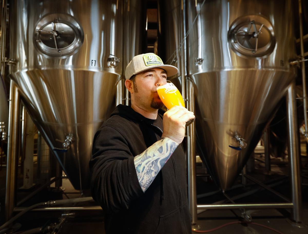 Brendan Gough, award-winning head brewer of Central Coast Brewing in San Luis Obispo, samples one of the brewery’s hazy IPAs.