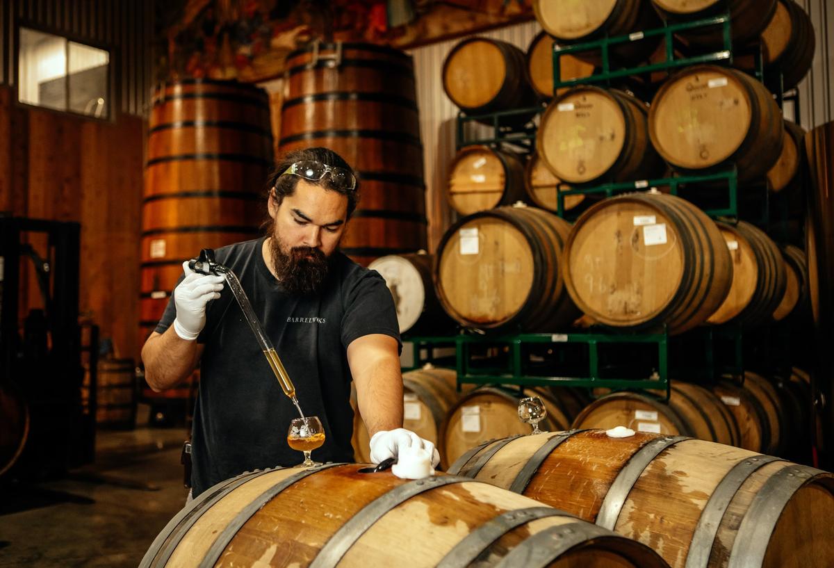 Firestone Walker Brewing Co. cellarman Beau Sorenson pulls a sample of a beer-wine blend made with cabernet franc grapes from Rock Hollow Vineyards in Santa Ynez, created for the Terroir Project.