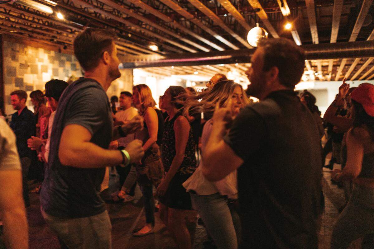 Guests dance at Bang the Drum Brewery in San Luis Obispo shortly after it moved to its new location on Laurel Lane in 2021.