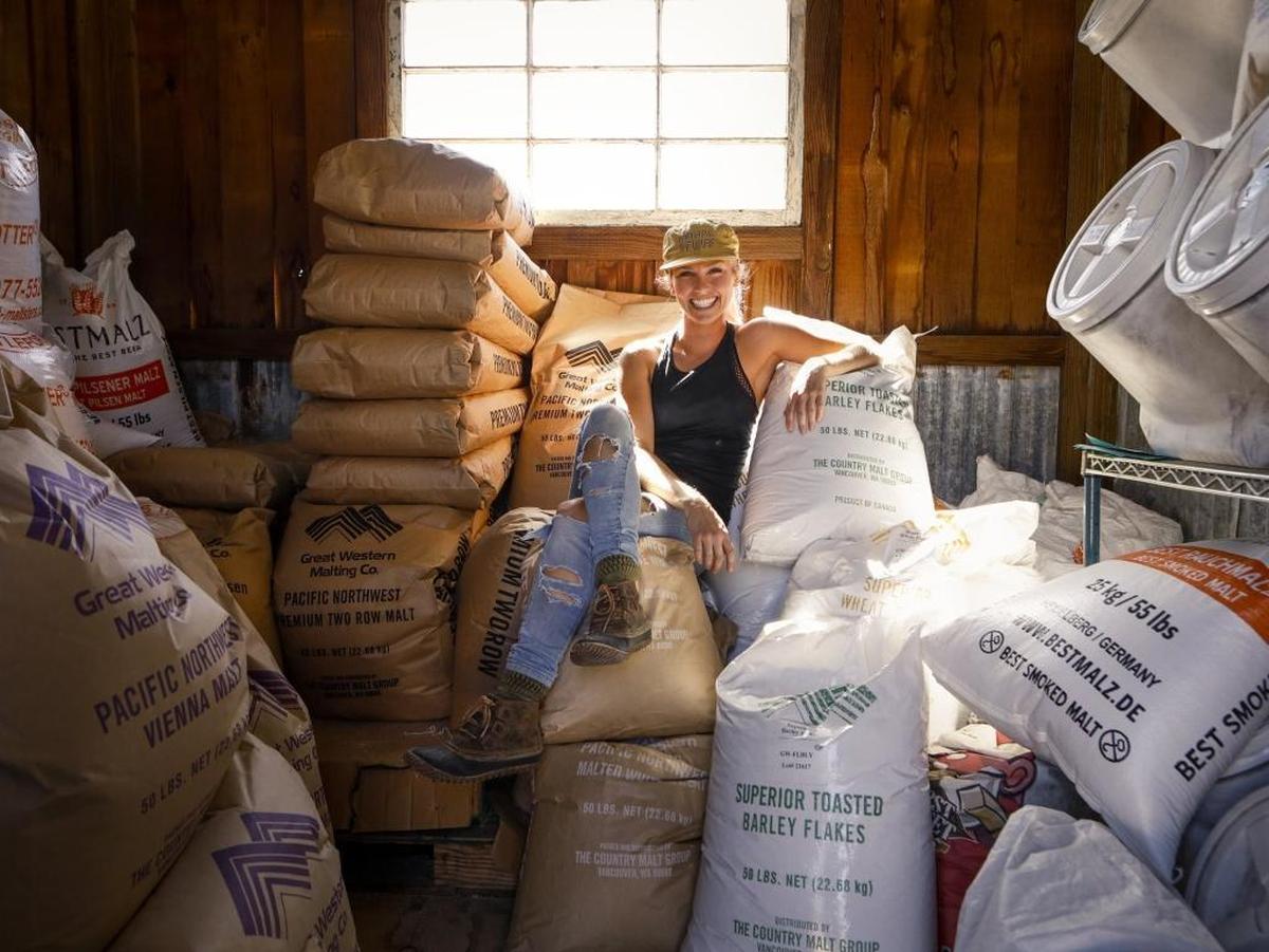Kelly Edward poses for a photo in the grain shed at Bang the Drum Brewery in San Luis Obispo. She is is the head brewer at the brewery.