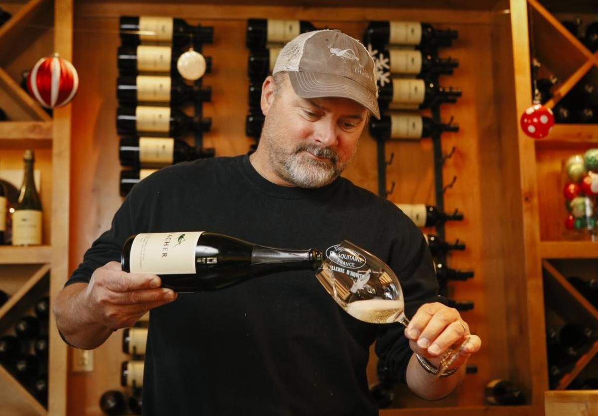 Sherman Thacher, winemaker and owner of Thacher Winery and Vineyard in Paso Robles, pours a glass of Thacher’ss 2013 Blanc de Blanc sparkling wine.