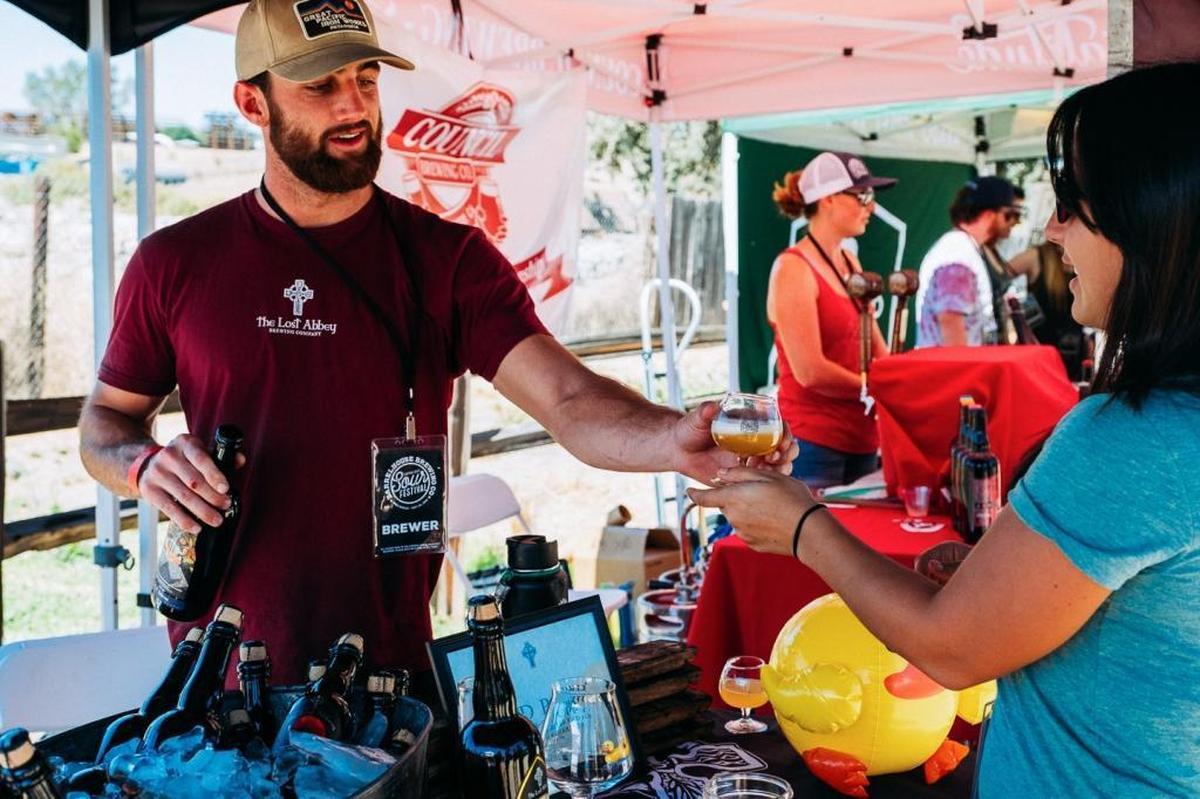 A pourer with The Lost Abbey Brewing Co. in San Marcos pours a glass at Central Coast Sourfest in 2016. The festival returns to BarrelHouse Brewing Co. in Paso Robles on Sept. 23.