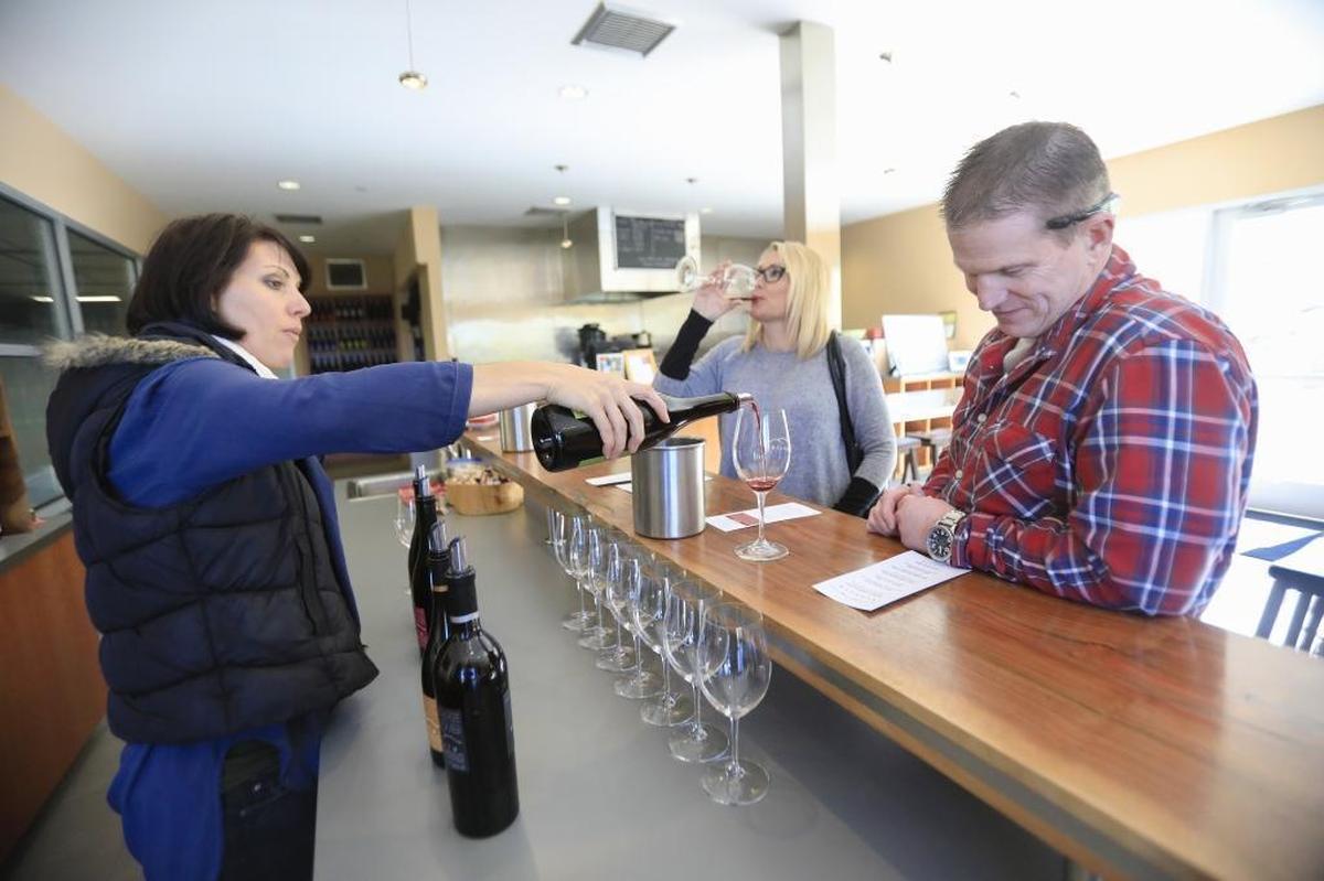 A server pours wine at the Kukkula Winery tasting room in Paso Robles in 2017.