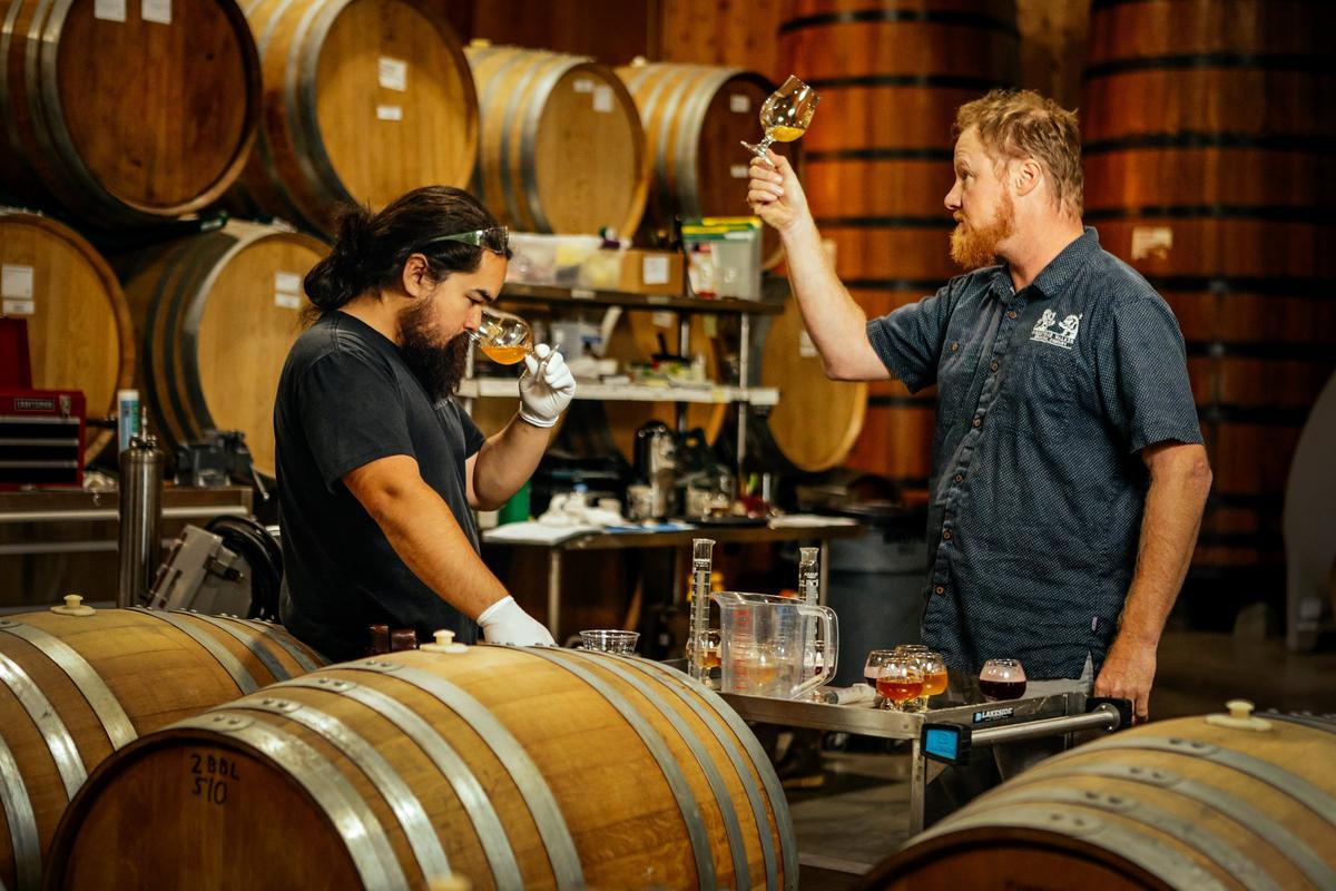 Cellarman Beau Sorenson, left, and master blender Jim Crooks sample some of their beer-wine hybrids, part of the Terroir Project at Barrelworks, the Buellton-based branch of Firestone Walker Brewing Co.