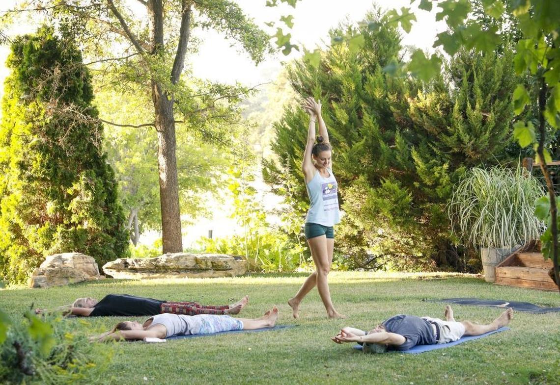 Yoga instructor Lauren Udsen leads a Vin & Yin yoga class at Castoro Cellars in Templeton.