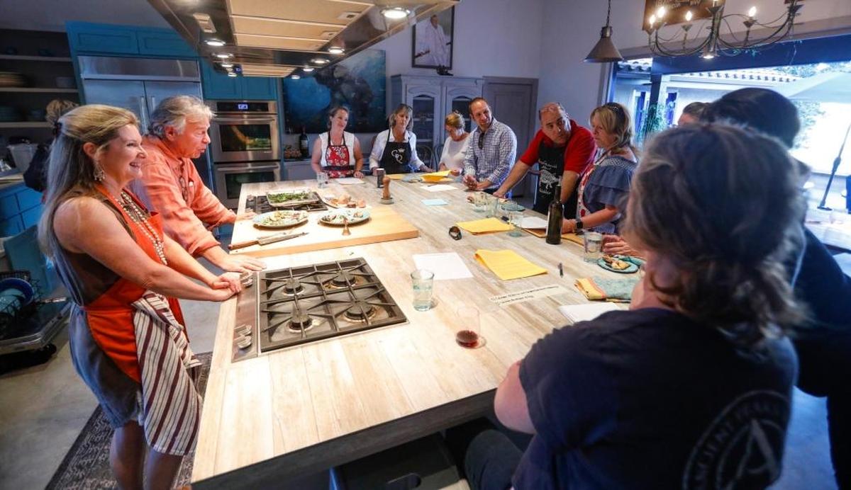 Brigit Binns and husband Casey Biggs talk to students at the start of an artisan pizza cooking class, offered through Binns’ Refugio Kitchen program in Paso Robles.