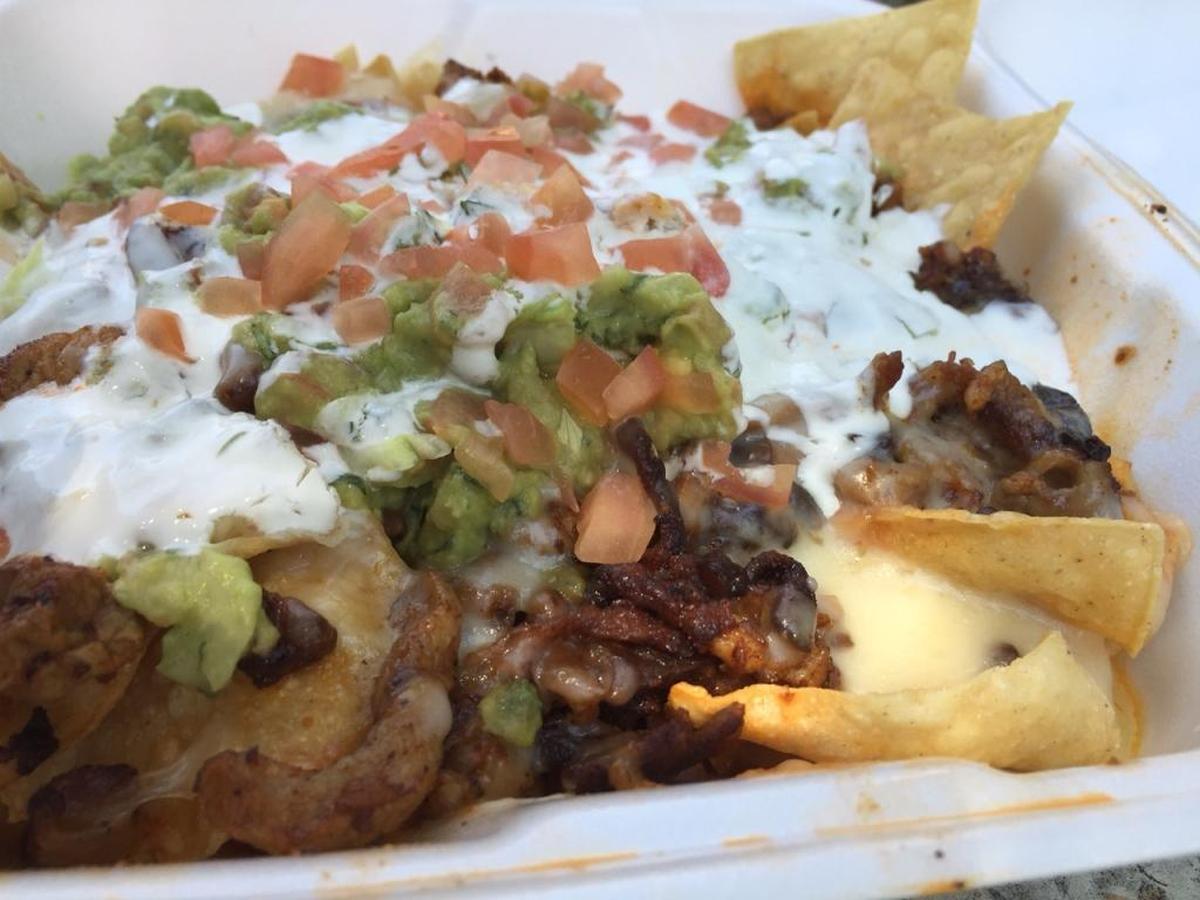 Super Nachos from Taqueria Santa Cruz in San Luis Obispo feature meat, beans, cheese, sour cream, guacamole and jalapeños.