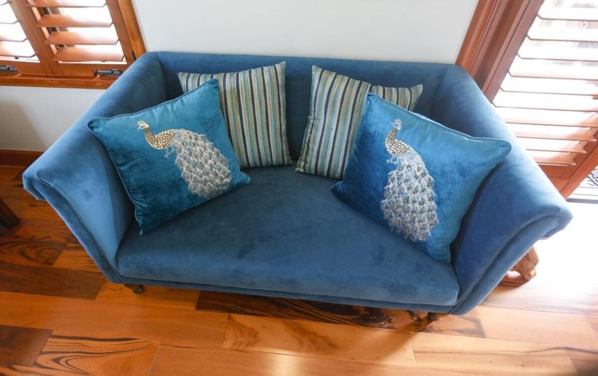Peacock blue accents such as this sofa were the inspiration behind the name for the Abdul Cader family’s guest suite in San Luis Obispo, The Peacock’s Nest.