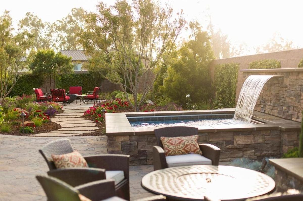 Susan and Michael McMillan worked with Addison Landscape and Design and Sun Pool Construction to produce an elegant yet functional outdoor living space with Old World character in the backyard of their Nipomo home.
