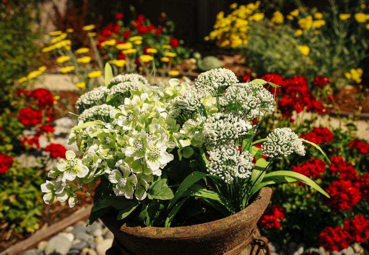 In Jake and Sharyn Schaffer's San Luis Obispo garden, faux flowers mix with real ones.