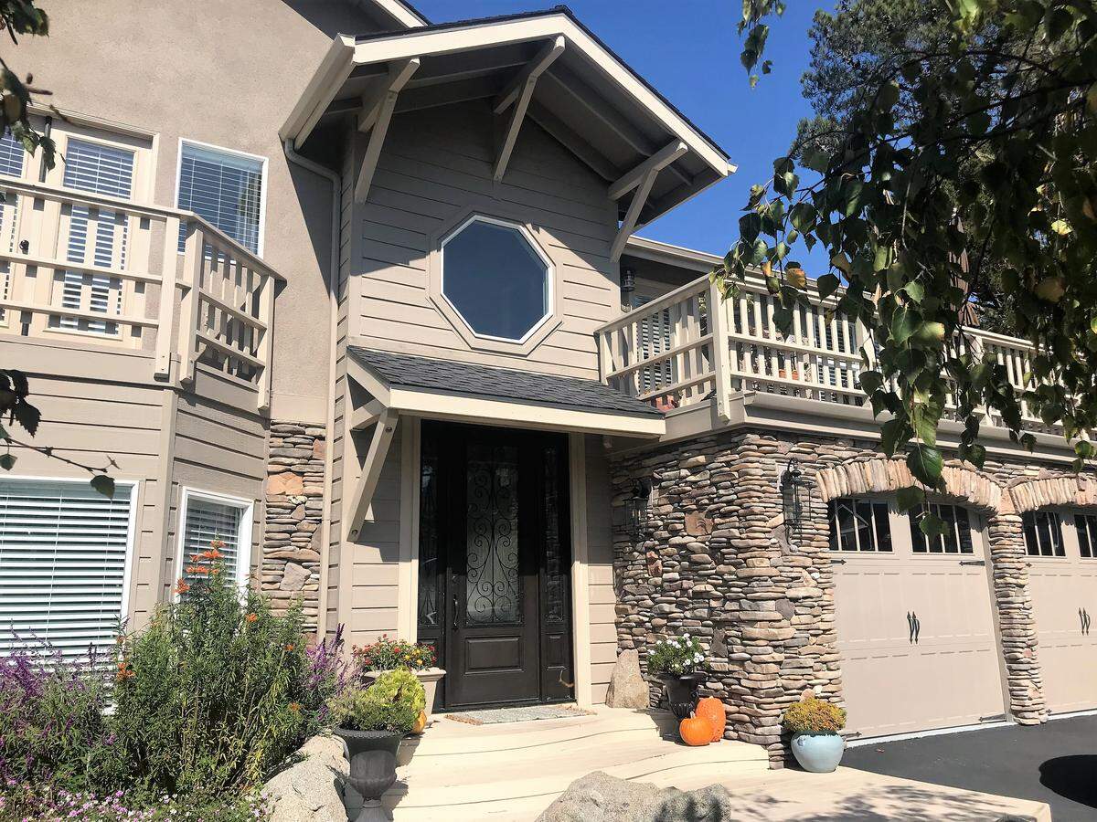 The exterior of Jeff and Melinda Baker’s Cambria home features stone accents and a new garage door.