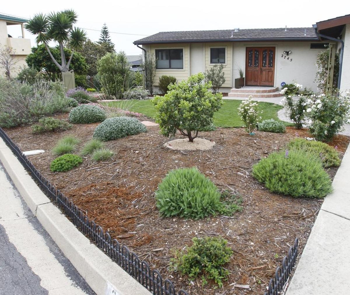 The Howards’ tidy front garden in Morro Bay awaits spring blooms.