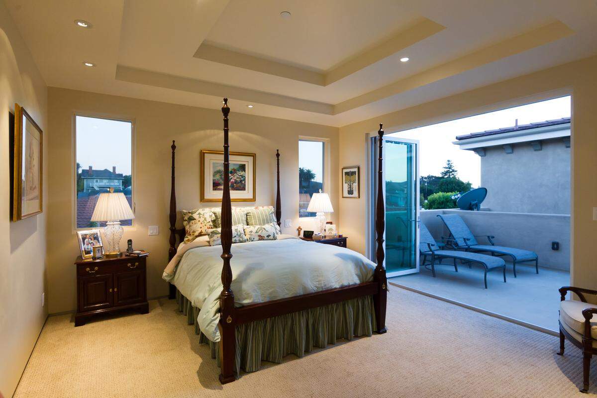 Bi-folding doors to the outside deck of Karen and Lee Bren's moden San Luis Obispo condominium unite interior and exterior spaces.